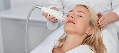 Woman laying back for laser procedure