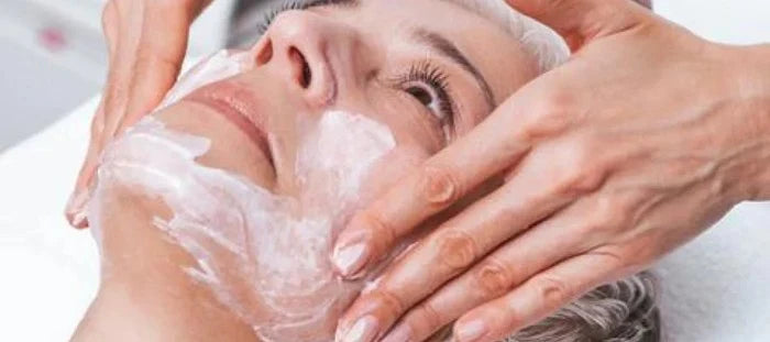 Woman receiving facial from dermatologist